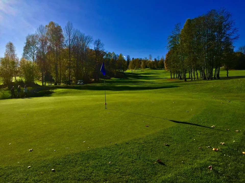 Asker Golf Club with parkland and forest course around small lakes outside Asker