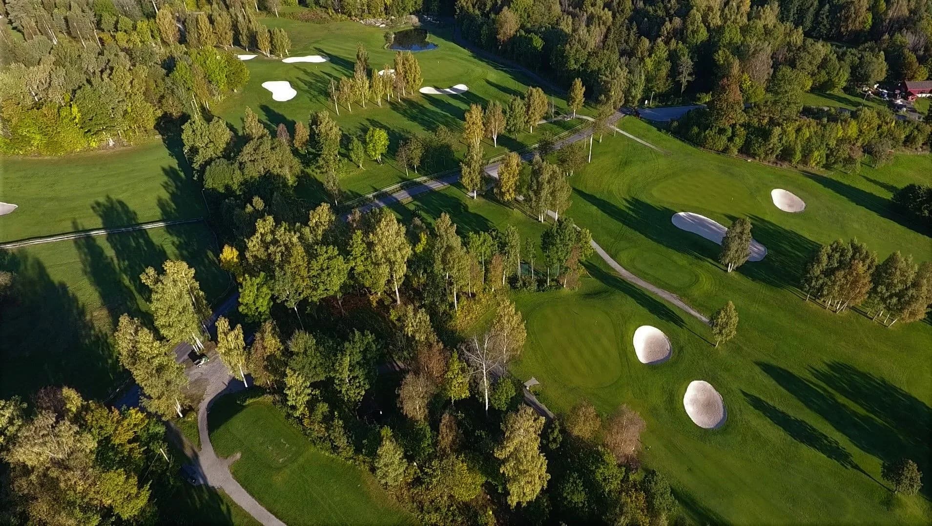 Aerial view of Asker Golf Club with fairways around Lake Finnrud, Lake Brendsrud and Lake Hogstad