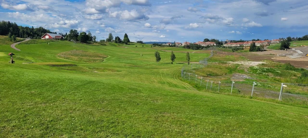 Hole 2 at Gjerdrum Golf Club with fairway through rolling ravine landscape