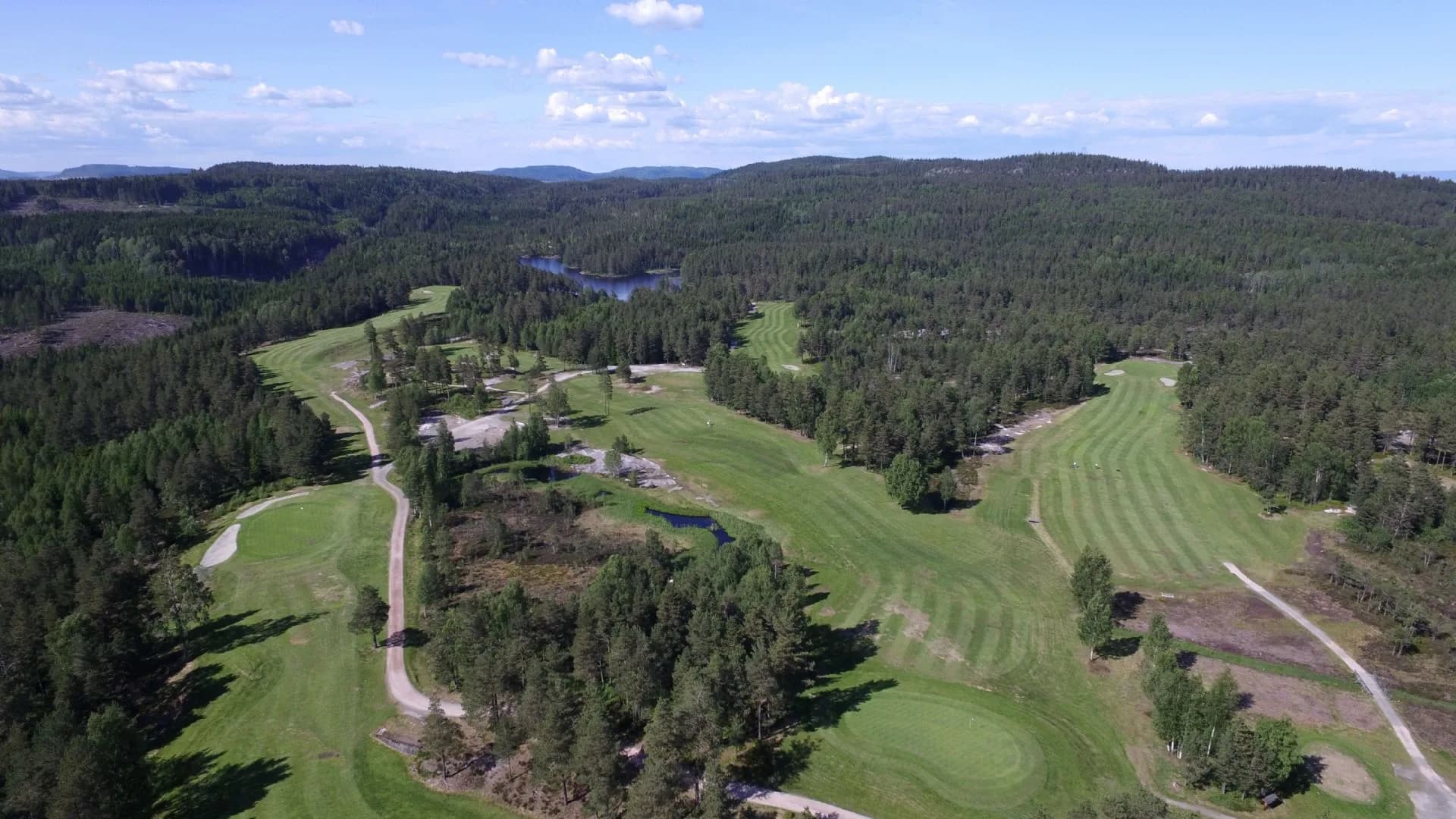Aerial view of Kjekstad Golf Club with 18-hole forest course in varied terrain near Røyken in Asker