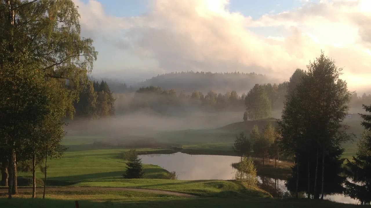 Overview of Krokhol Golf Club with fairways and greens in forest terrain