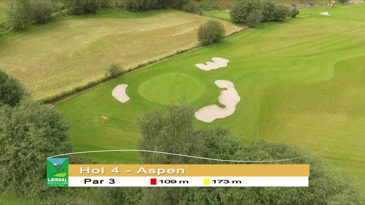 Aerial view of hole 4 (Aspen) at Lærdal Golf Club with par 3 green and bunkers surrounded by farmland terrain