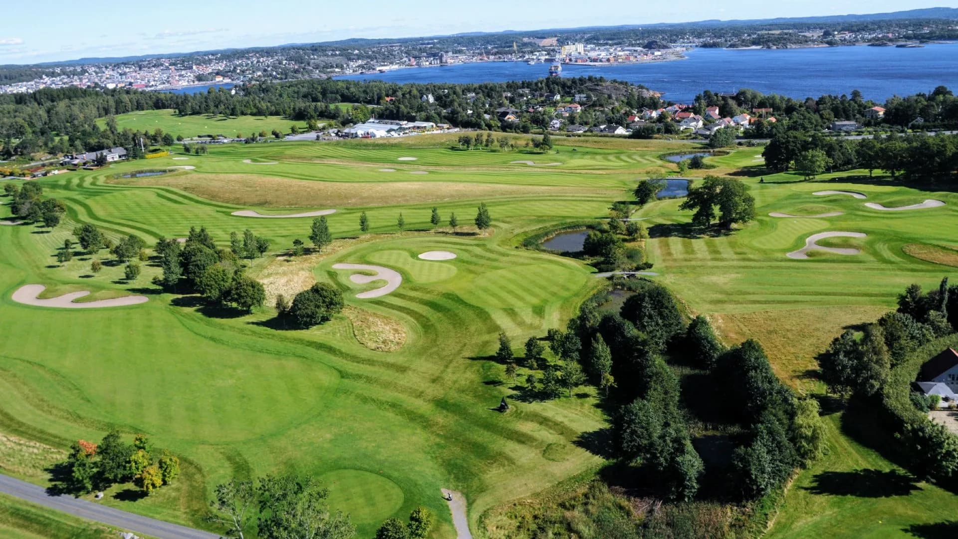 Aerial view of Larvik Golf Club with Seasidebanen course, clubhouse and surrounding landscape in Vestfold