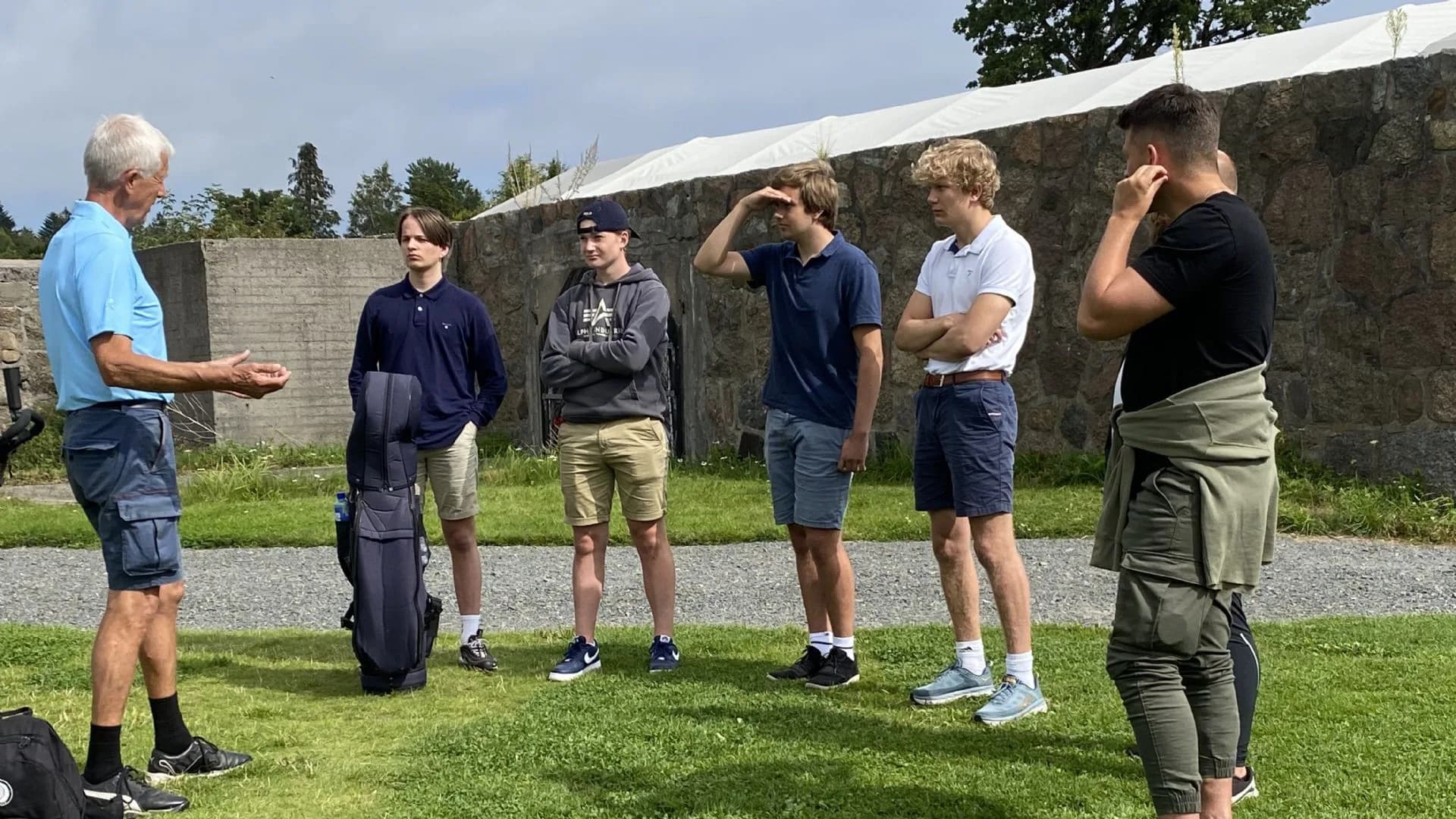 Putting green at Larvik Golf Club with golfer practicing short game