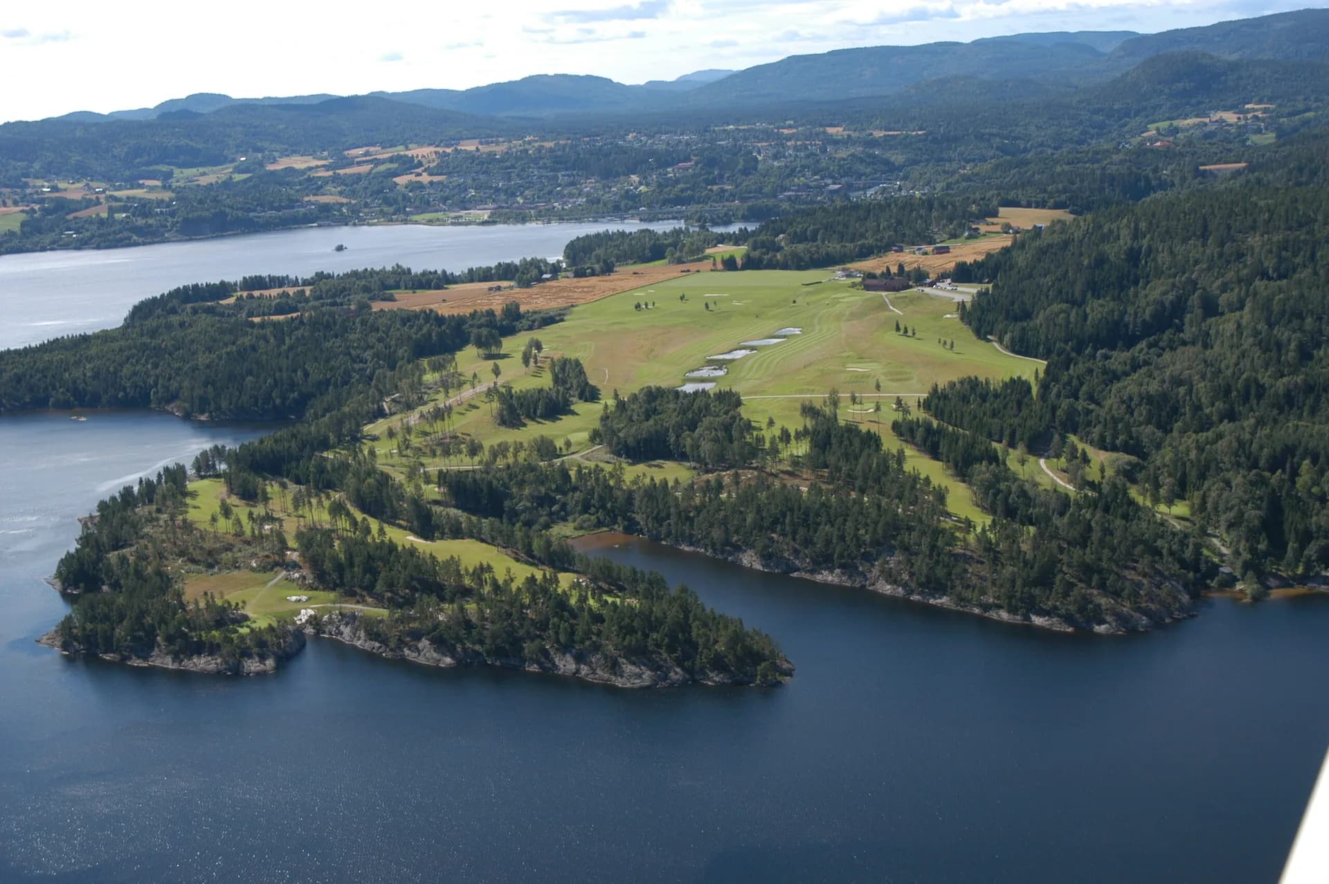 Aerial view of Norsjø Golf Club showing fairways and scenic natural surroundings