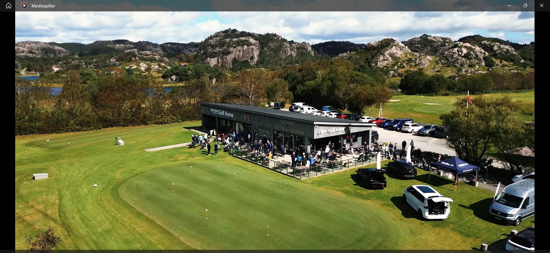 Aerial view of the clubhouse and putting green at Ogna Golf Club