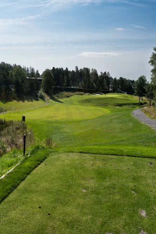 Tee box with view over fairway and forest at Oppegård Golf Club in Akershus