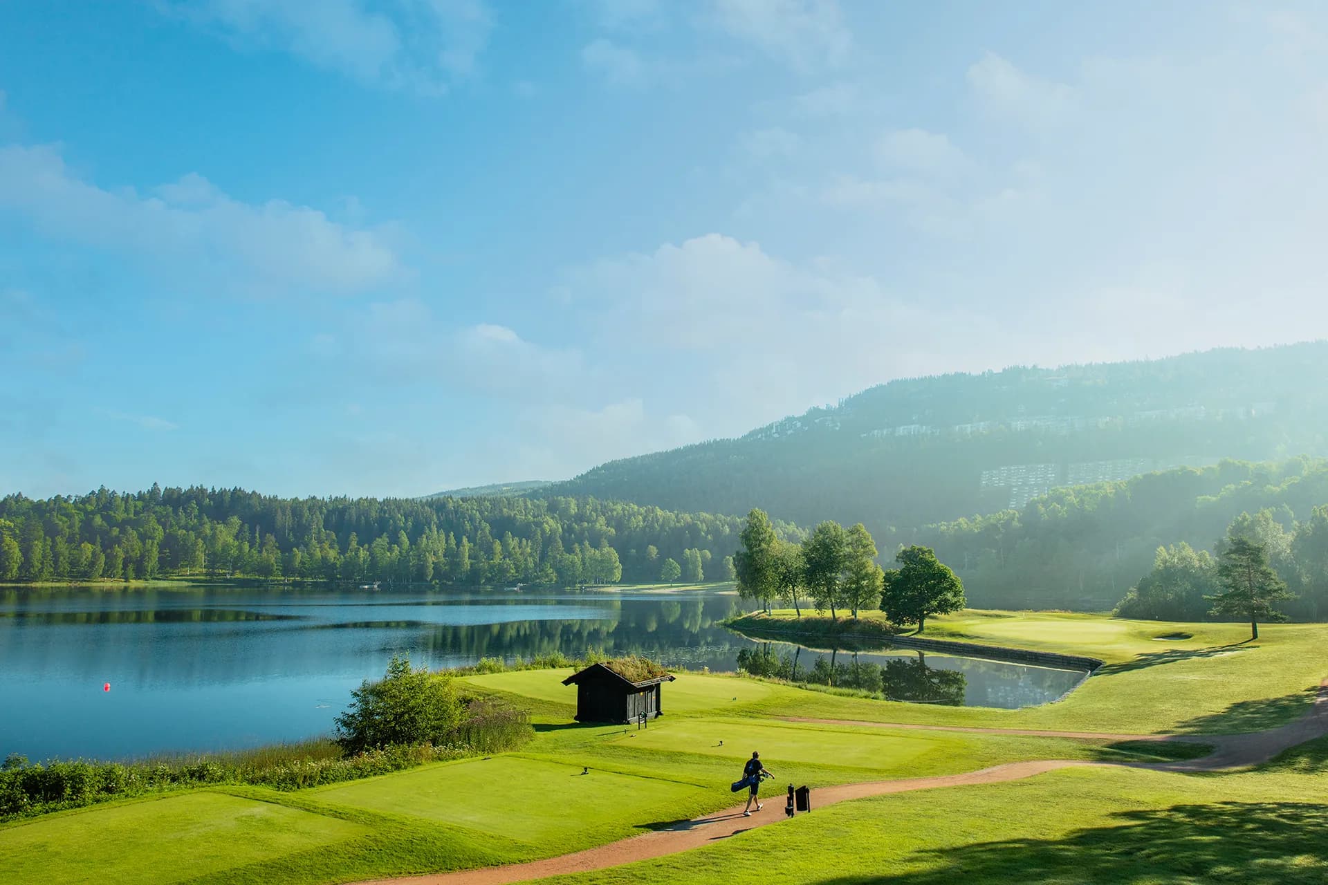 Fairway at Oslo Golf Club with characteristic rolling terrain and scenic natural surroundings
