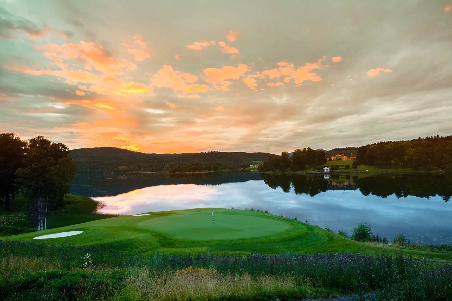 Hole 14 at Oslo Golf Club with fairway stretching through forest terrain