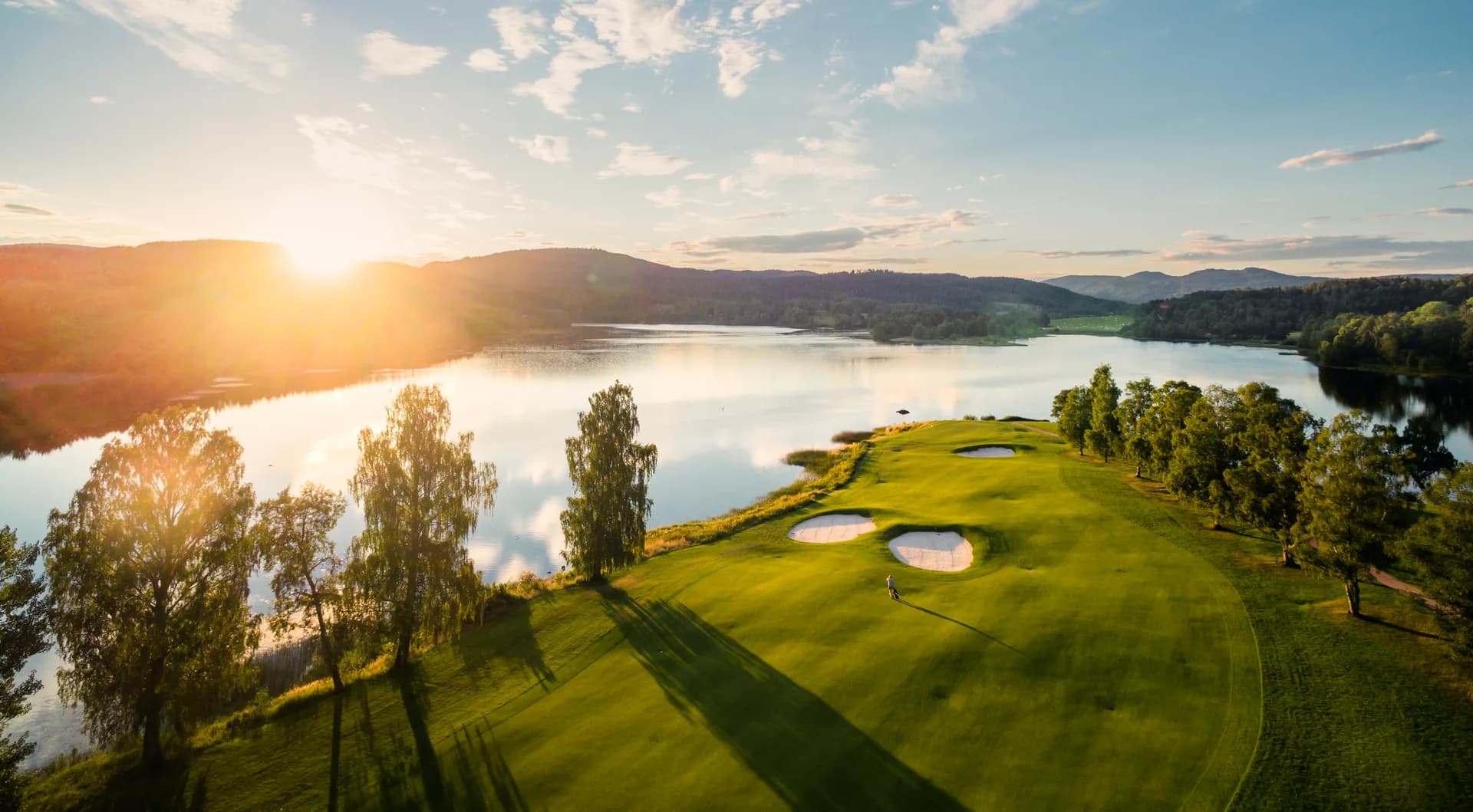 Overview of Oslo Golf Club at Bogstad with fairways, greens and Marka forest in the background