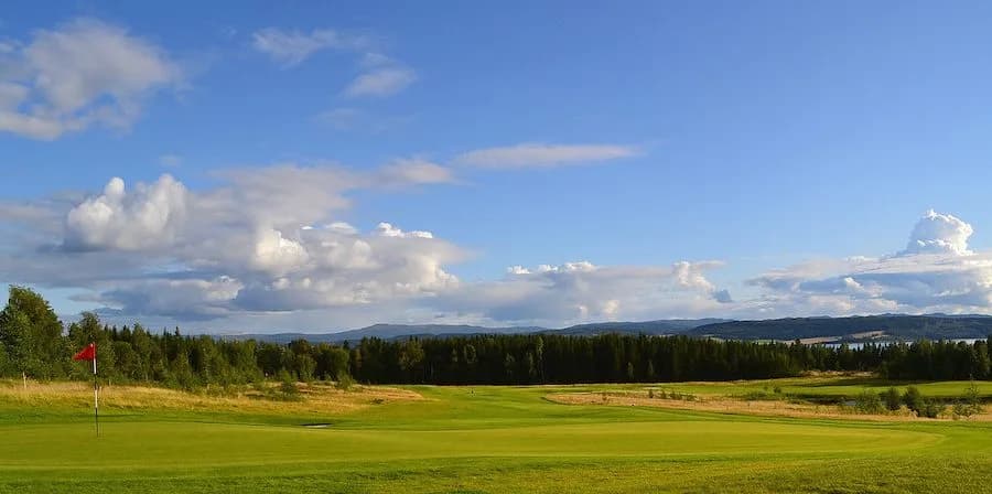 Hole 18 at Stiklestad Golf Club with green and view over the Trondheim Fjord at Trones