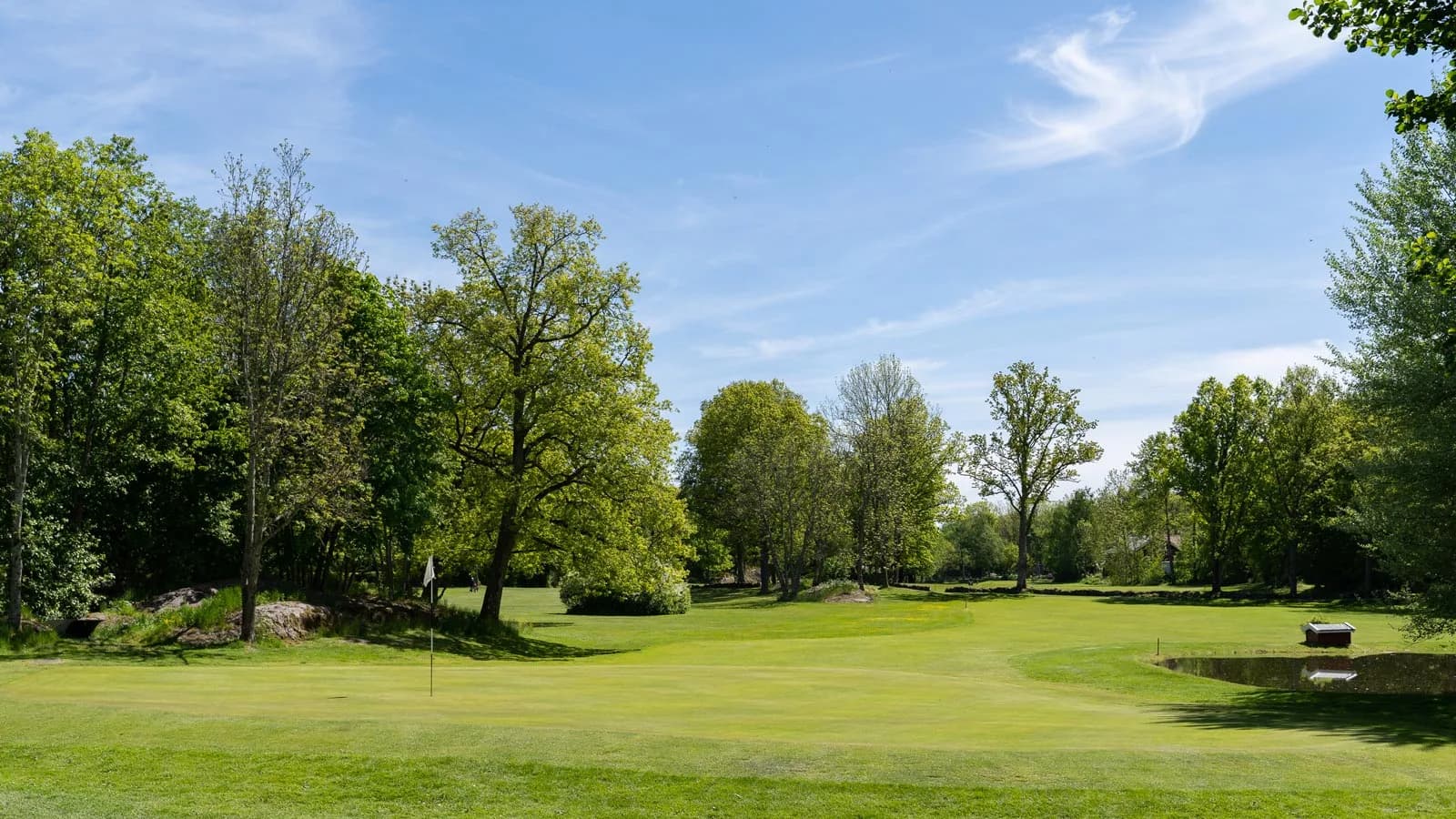 Green with water hazard and wooden bridge at Tjøme Golf Club in Vestfold