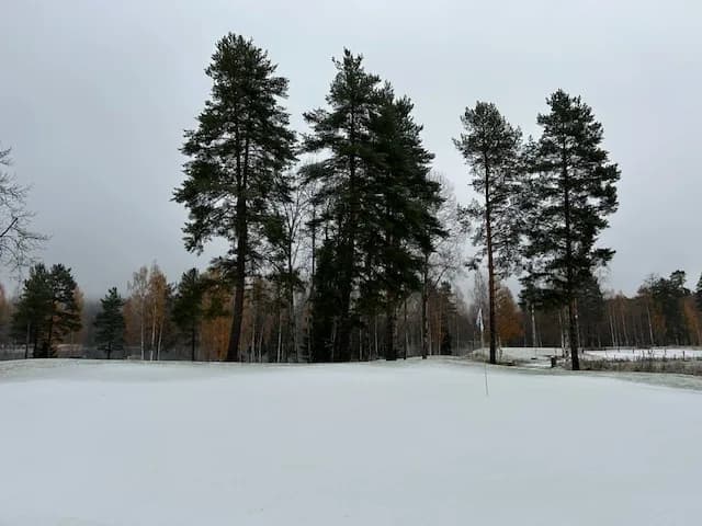Golf course at Valdres Golf Club in scenic terrain by Lake Aurdal